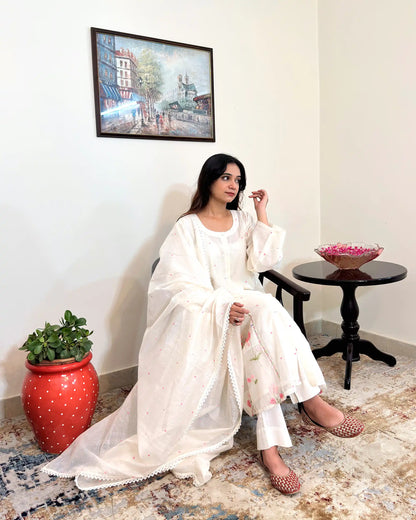 Front view of the off-white chanderi A-line kurta with pink resham embroidery, worn with off-white trousers.
