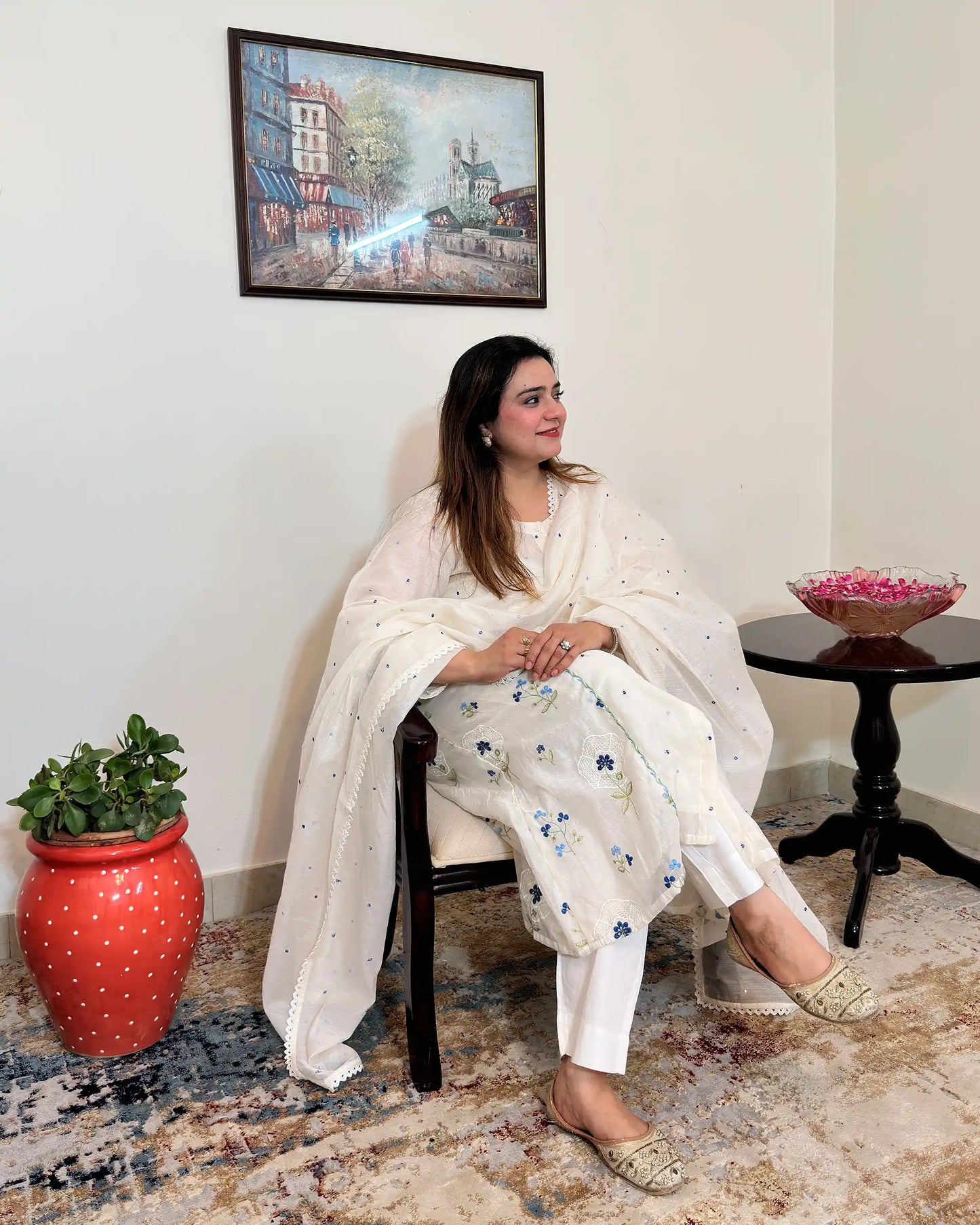 Front view of an off-white chanderi A-line kurta with dupatta on, showing blue floral resham embroidery on the kurta and scattered floral resham embroidery with a lace edge on the dupatta, paired with off-white trousers.