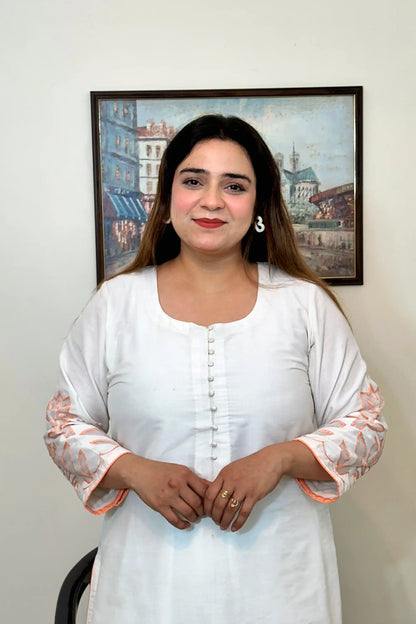 Front close-up of the off-white chanderi kurta showing the button placket and floral cutwork on the sleeve.