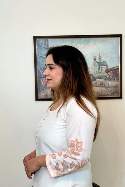 Side view close-up of the off-white chanderi kurta showing the button placket and floral cutwork on the sleeve.