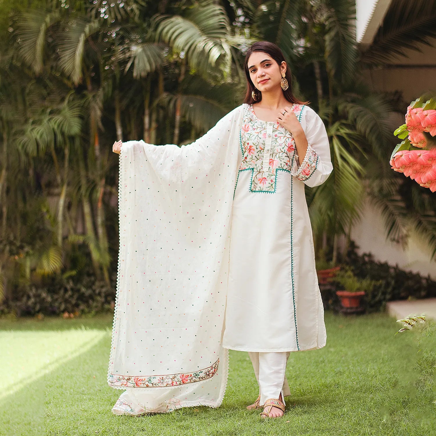 Indian woman dressed in a soft off-white cotton kurta with Kashmiri work, paired with embroidere dupatta and plain trousers.