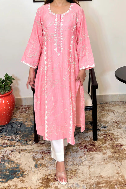 Front view of the pink chanderi kalidar kurta's upper body, showing floral resham embroidery across the bodice and off-white applique work along the neckline and button placket.
