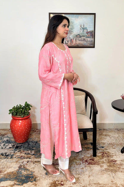 Right side view of the pink chanderi kalidar kurta and off-white cotton-silk trousers, showing the side slit and floral resham embroidery along the panel.