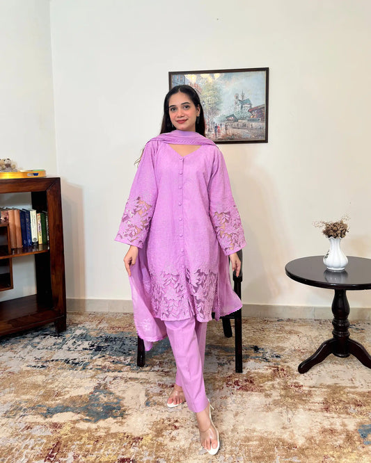 Front view of a purple cotton straight kurta with dupatta, worn with purple trousers, featuring floral cutwork embroidery at the sleeves and hem.