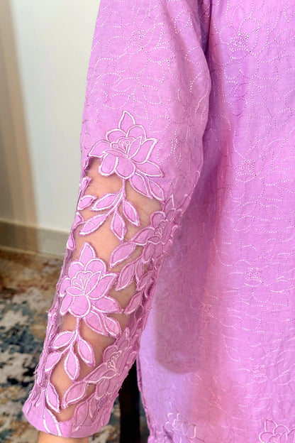 Close-up sleeve view of a purple cotton kurta showing floral cutwork embroidery with sheer cutout details.