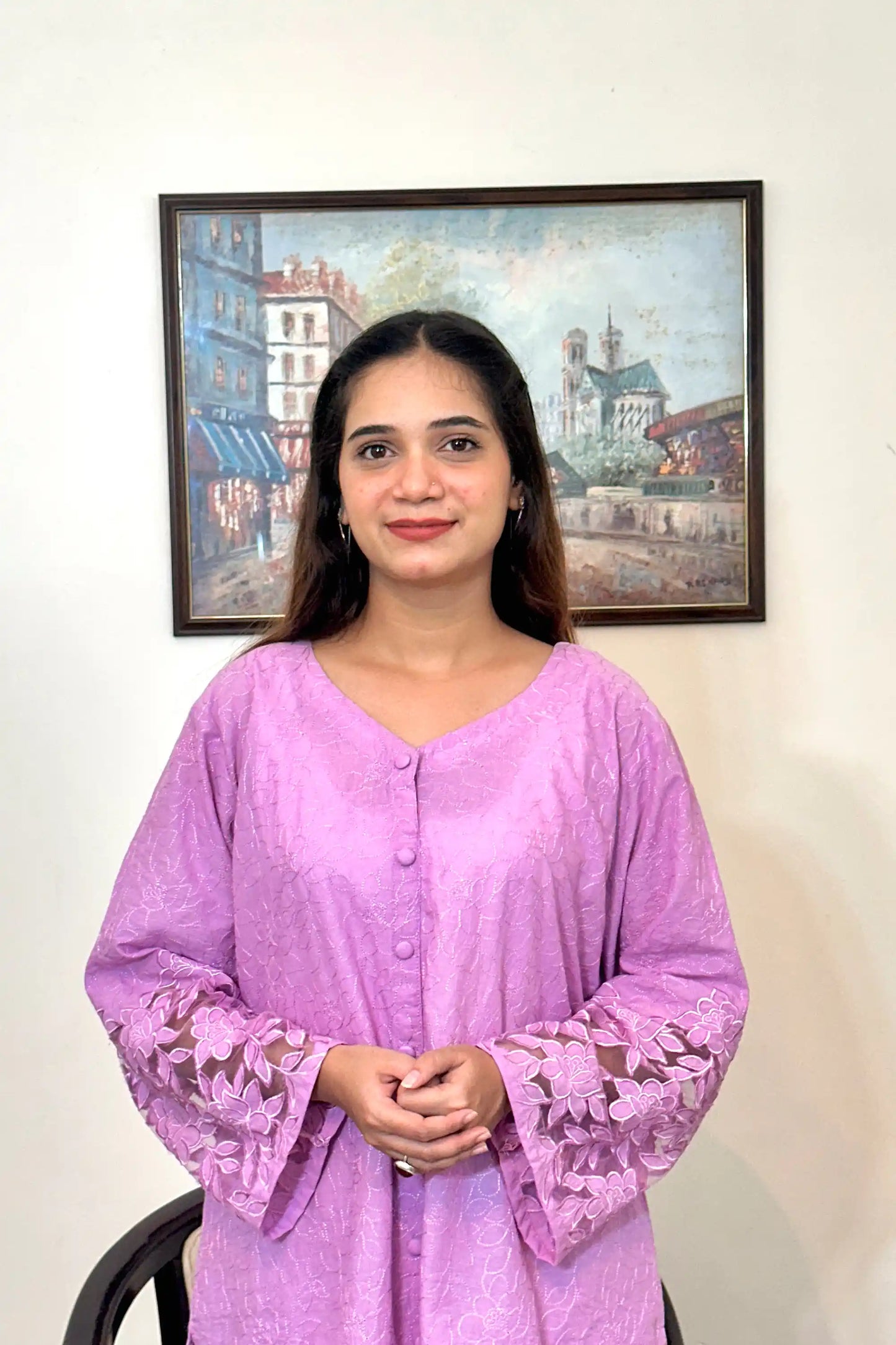 Front view of a purple cotton straight kurta, featuring floral cutwork embroidery on the sleeves.