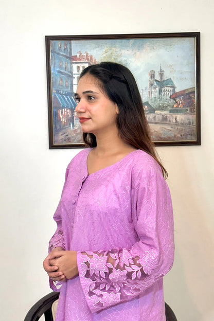 Side view of a purple cotton straight kurta, featuring floral cutwork embroidery on the sleeves and button placket.