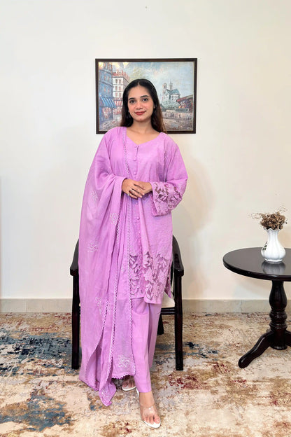 Front view of a purple cotton straight kurta with dupatta, worn with purple trousers, featuring floral cutwork embroidery on the sleeves and hem, and floral embroidery on the dupatta.