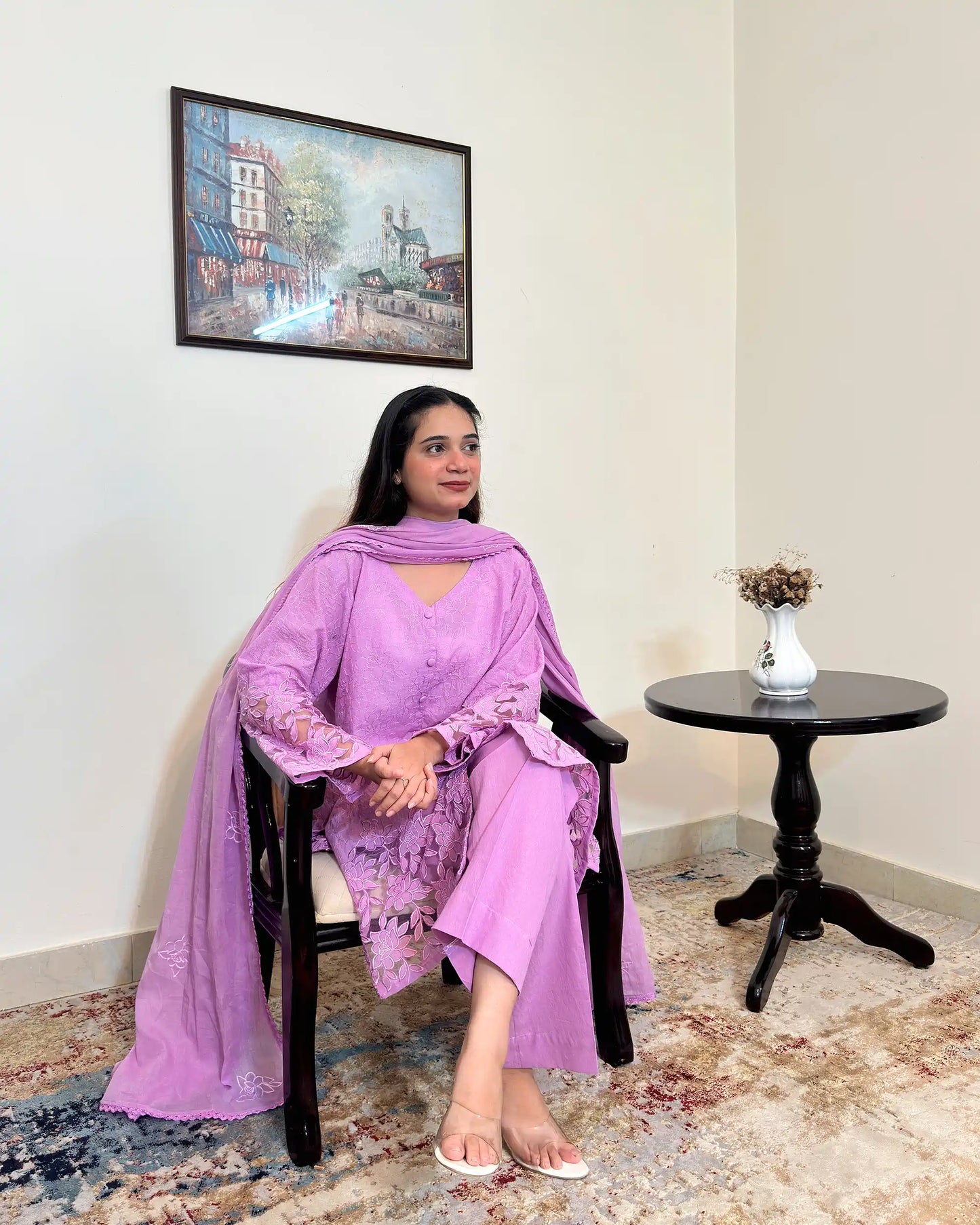 Front view of a purple cotton straight kurta with dupatta, worn with purple trousers, featuring floral cutwork embroidery on the sleeves and hem, and floral embroidery on the dupatta.
