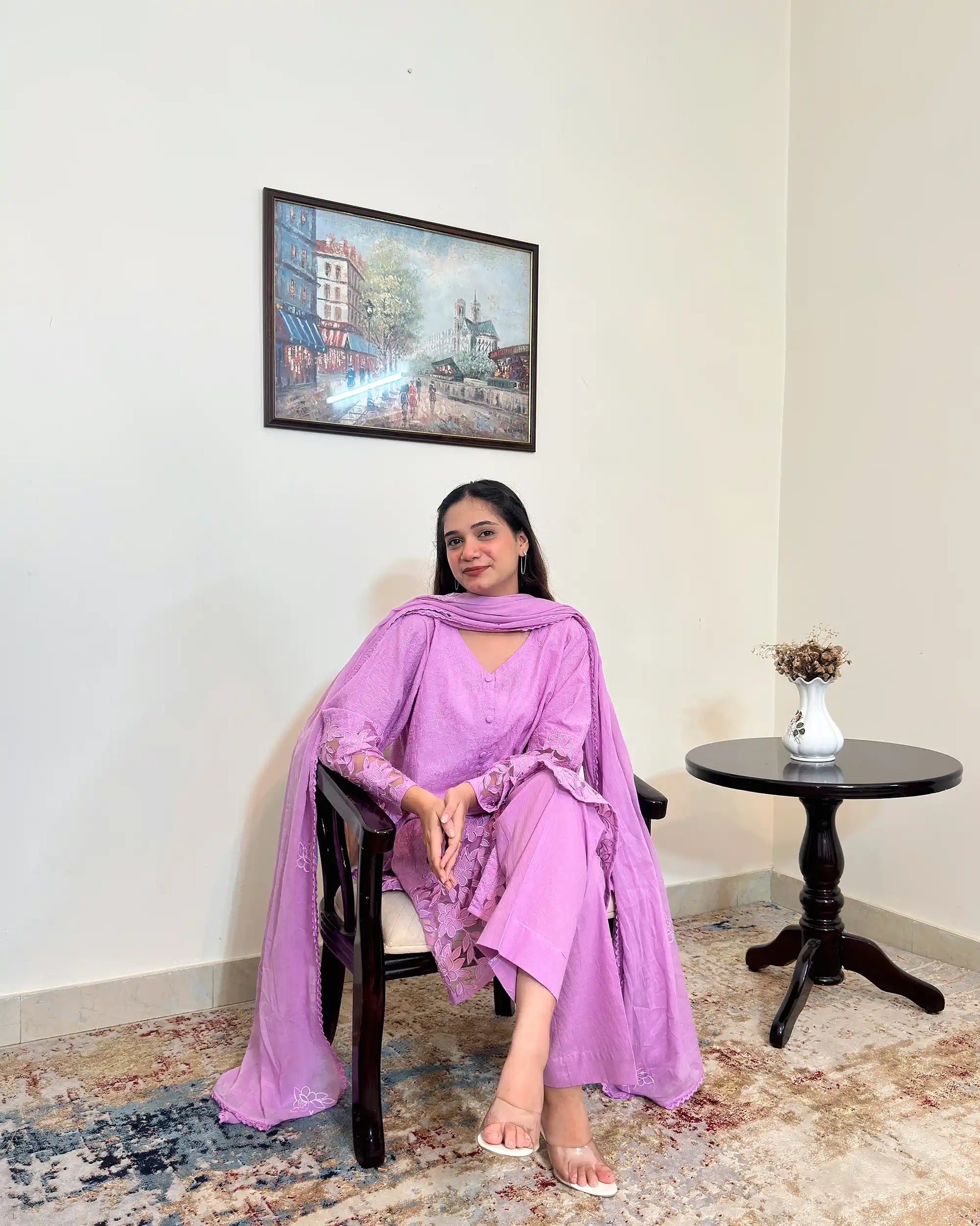 Front view of a purple cotton straight kurta with dupatta, worn with purple trousers, featuring floral cutwork embroidery on the sleeves and hem, and floral embroidery on the dupatta.