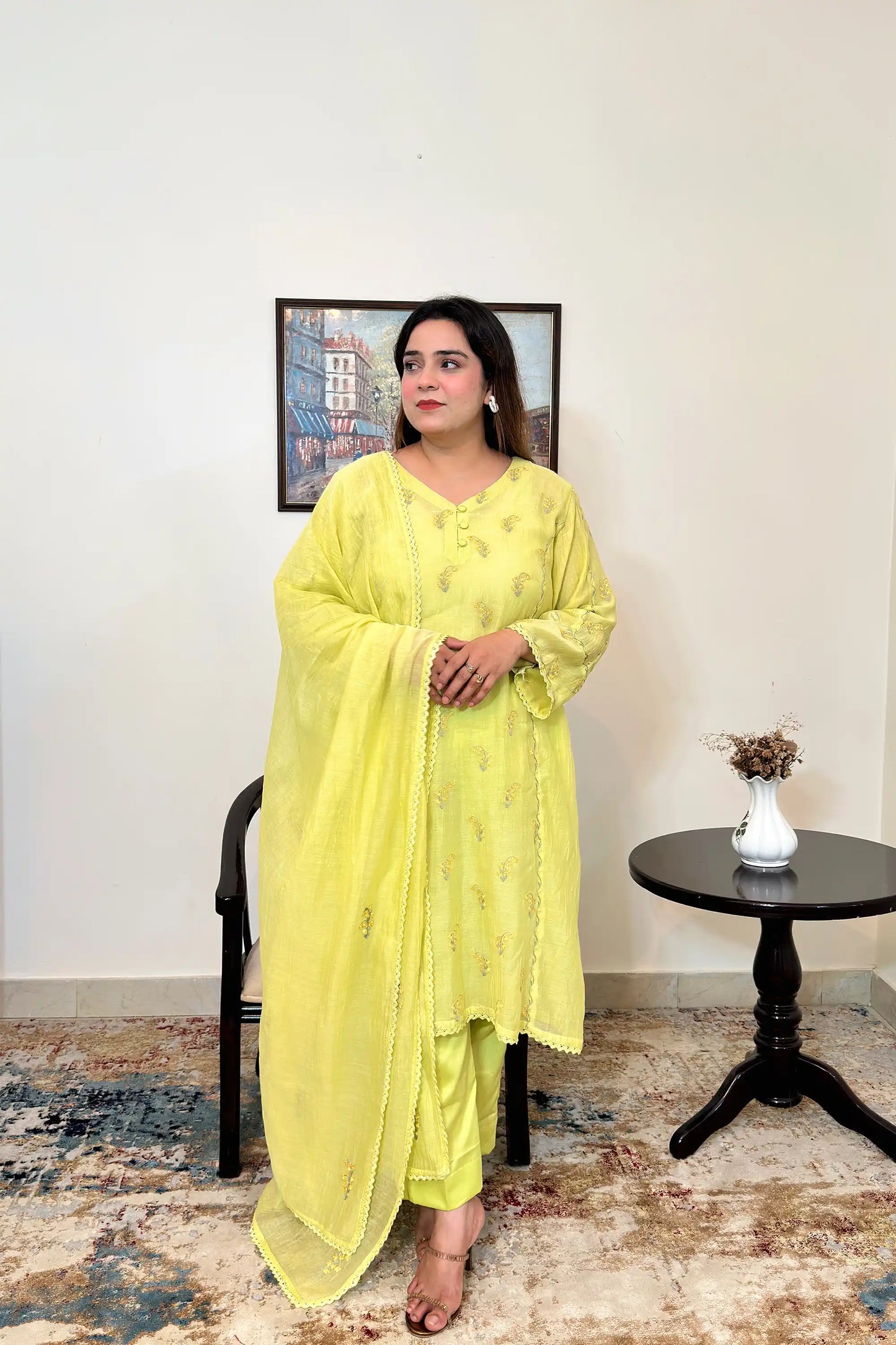 Front view of a lemon-yellow chanderi kalidar kurta and dupatta, showing floral resham embroidery on the kurta and dupatta, paired with lemon-yellow trousers.
