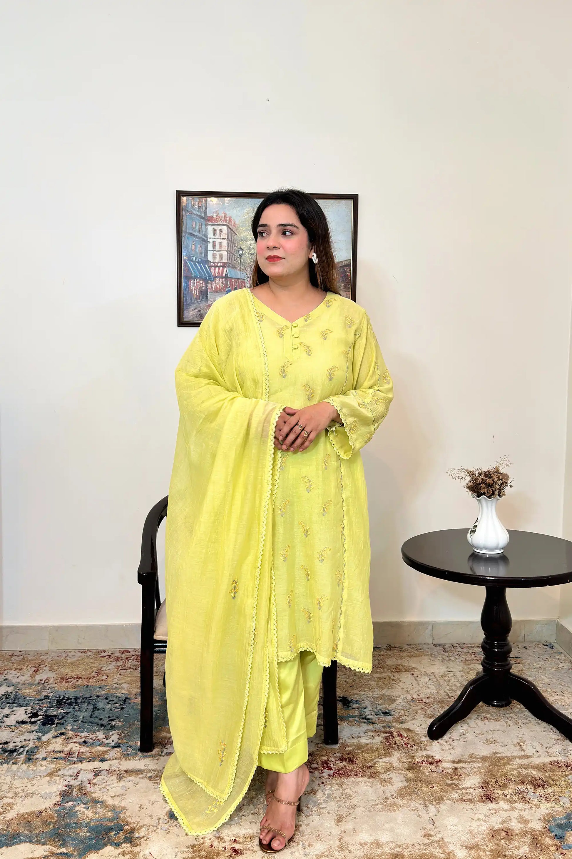 Front view of a lemon-yellow chanderi kalidar kurta and dupatta, showing floral resham embroidery on the kurta and dupatta, paired with lemon-yellow trousers.