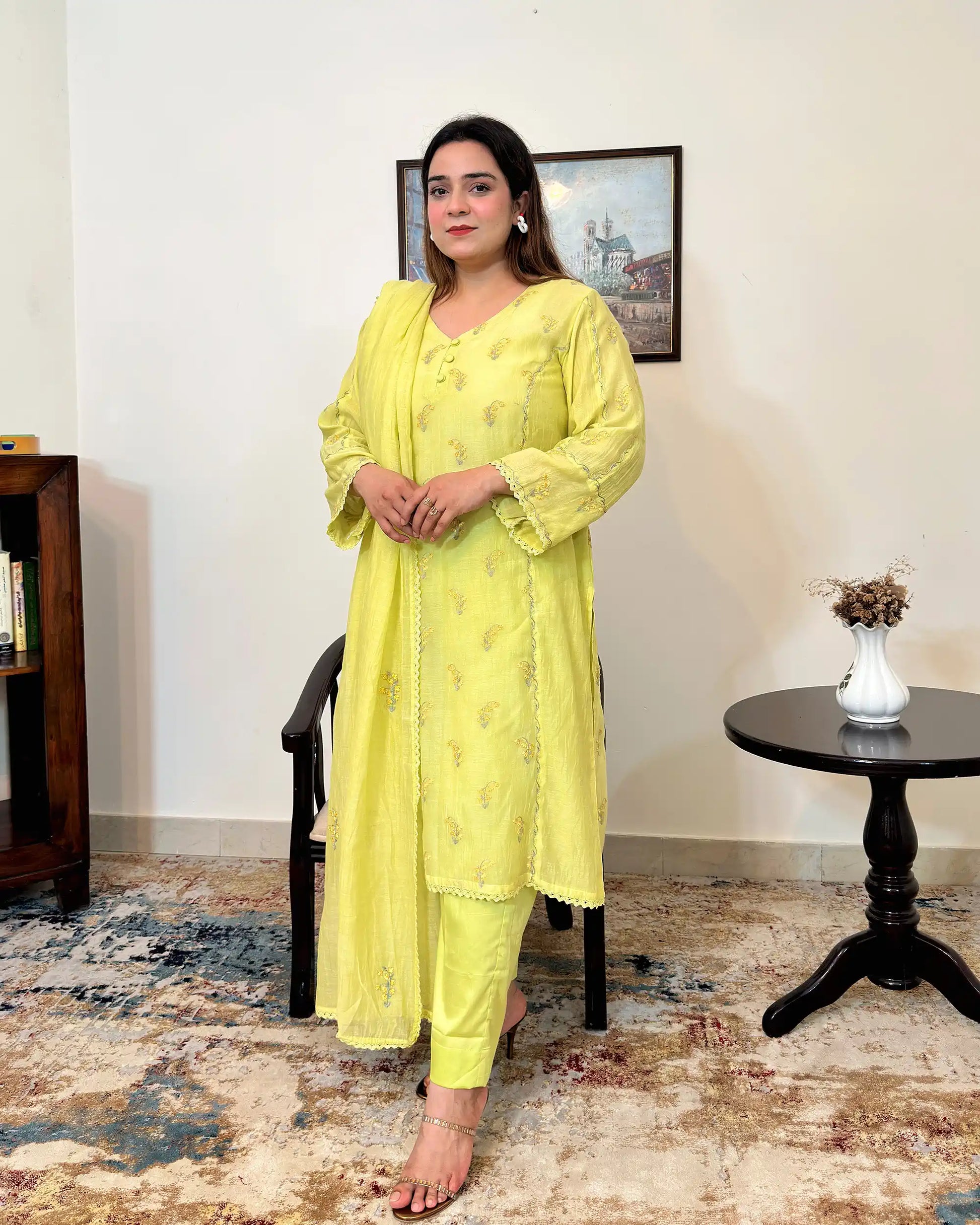 Front view of a lemon-yellow chanderi kalidar kurta with dupatta, showing floral resham embroidery on the kurta and dupatta, paired with lemon-yellow trousers.