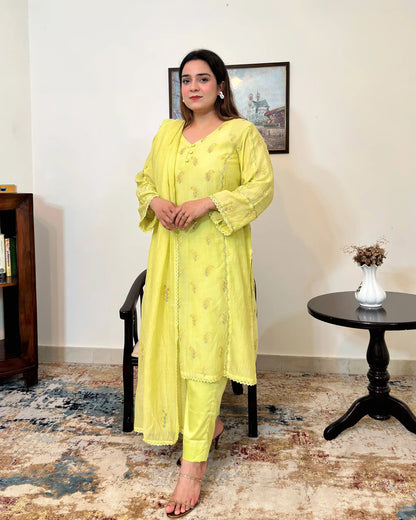 Front view of a lemon-yellow chanderi kalidar kurta with dupatta, showing floral resham embroidery on the kurta and dupatta, paired with lemon-yellow trousers.
