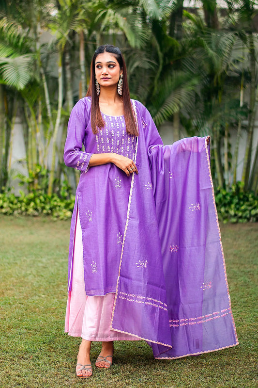 Front view (full suit, top to bottom): Model wearing a purple chanderi kurta with aari embroidery and applique work, pale pink palazzo, and a matching dupatta.