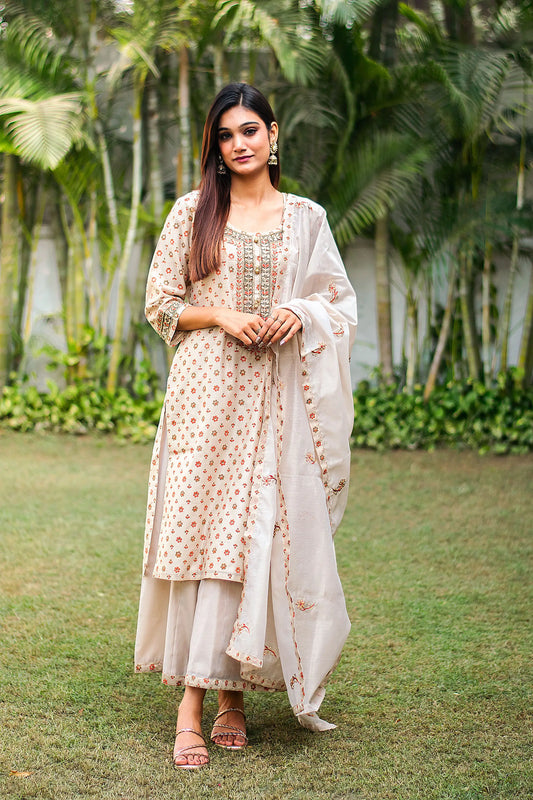 Front view (full suit, top to bottom): Model wearing a beige printed chanderi kurta with zardozi work, beige palazzo, and a coordinating dupatta.