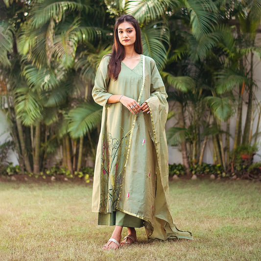 Complete ensemble of the green embroidered kurta set, including the green chanderi angrakha, green palazzo and green chanderi embroidered dupatta, as worn by the model.