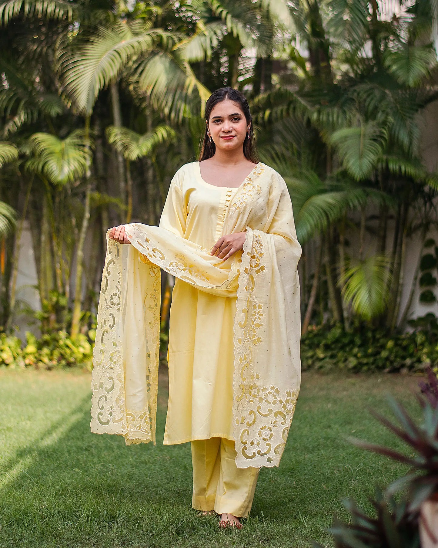 Pastel yellow russian silk kurta & trousers, peach chanderi dupatta with cutwork