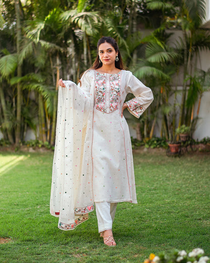 Indian woman in a kalidar style off-white kurta set with Kashmiri thread work. 