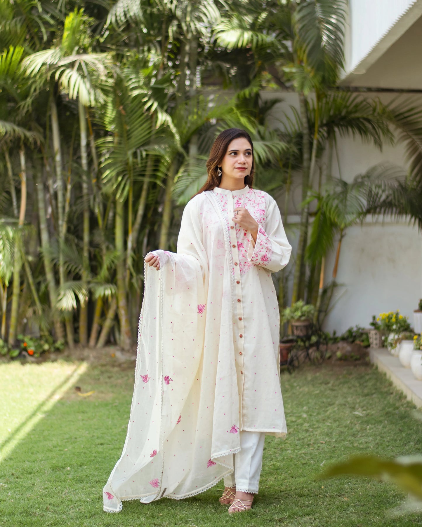 Indian model in an off-white front-open kurti and dupatta with Kashmiri embroidery and matching trousers