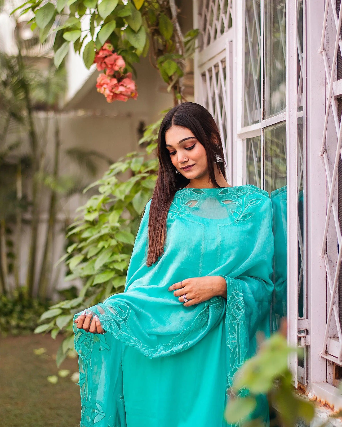 Turquoise green Russian silk kurta & trousers, turquoise green chanderi dupatta with cutwork.