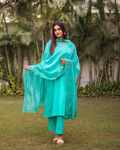 Turquoise green Russian silk kurta & trousers, turquoise green chanderi dupatta with cutwork.