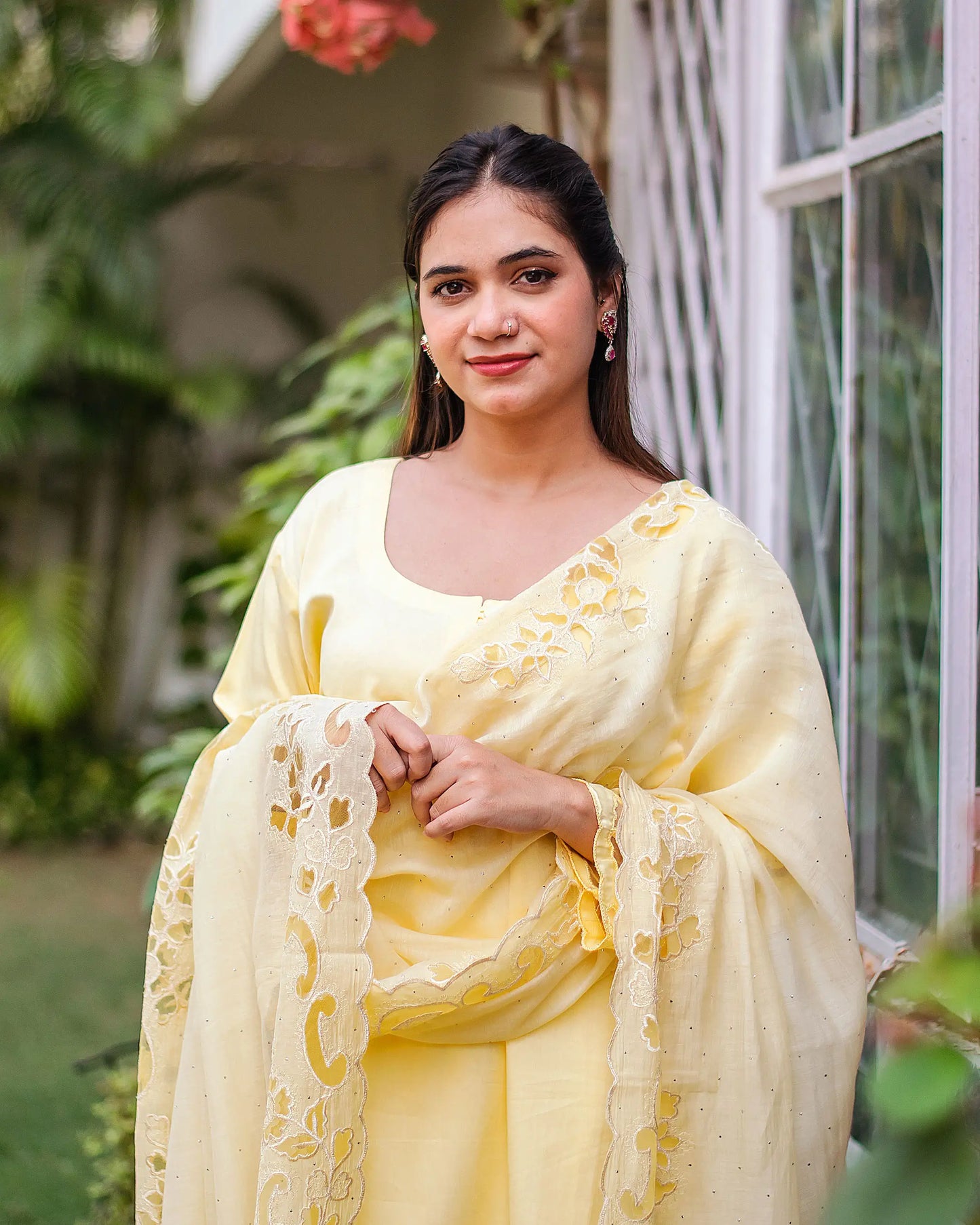 Pastel yellow russian silk kurta & trousers, peach chanderi dupatta with cutwork