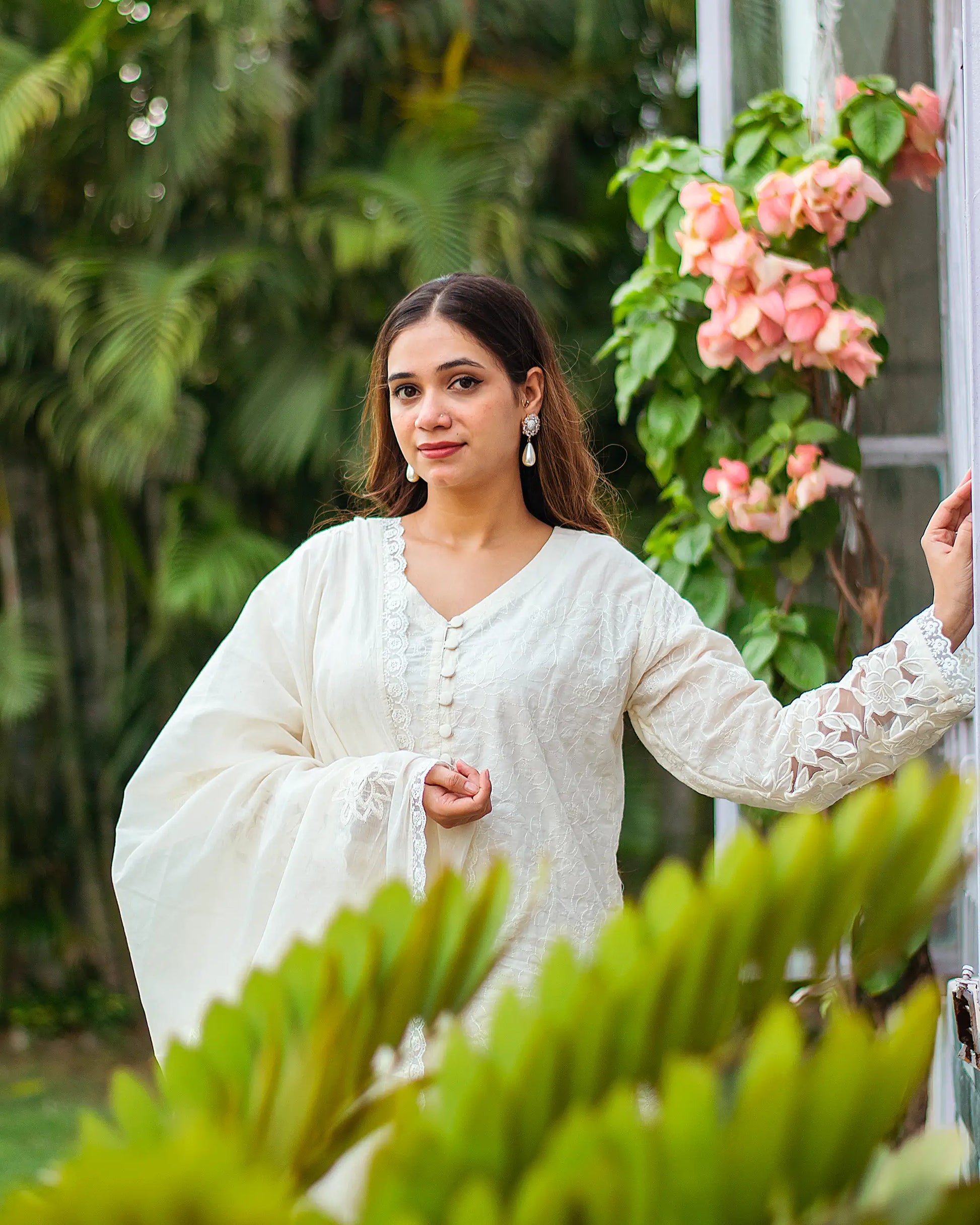 Detailed view of the kurta and dupatta, highlighting the intricate cutwork.