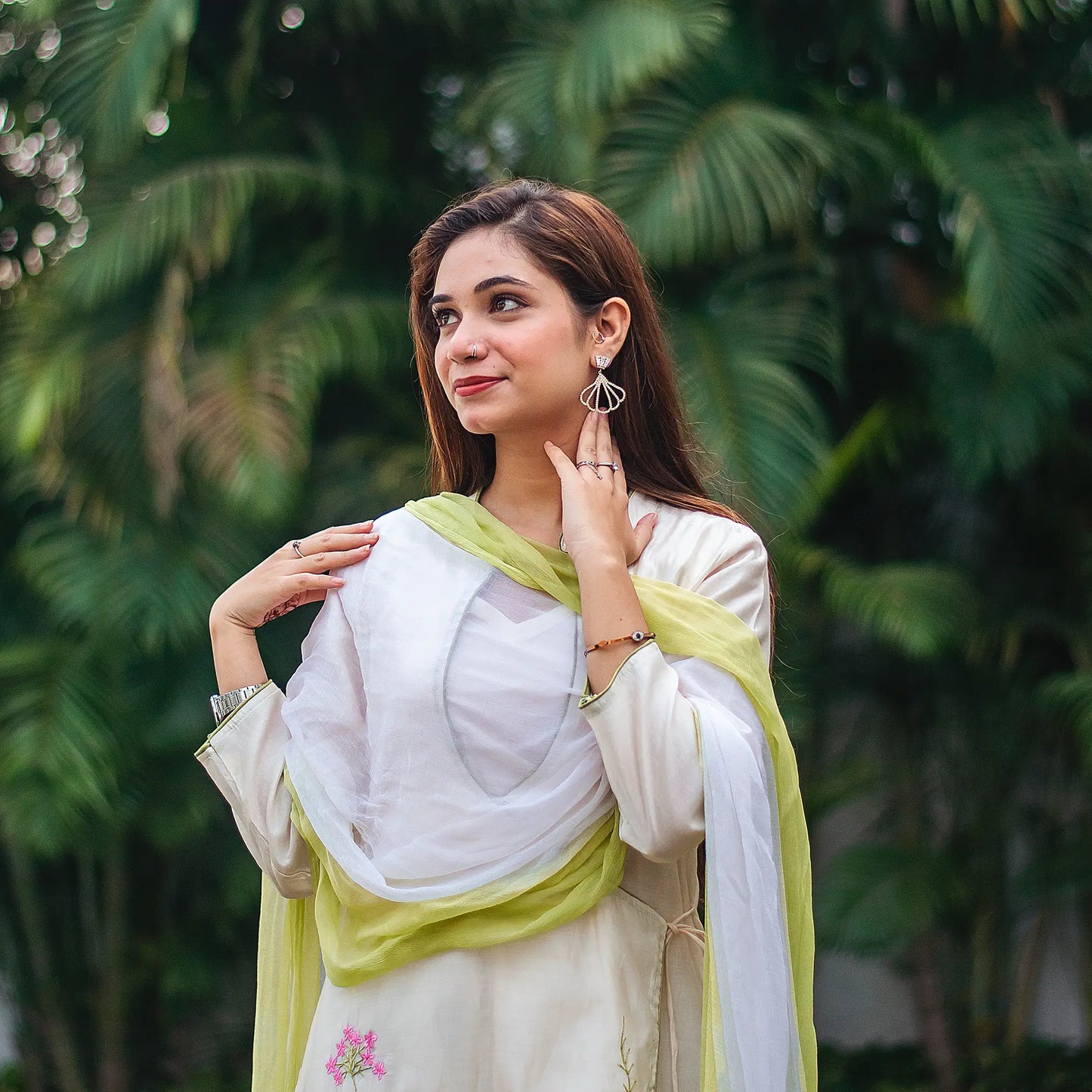 Close-up of the intricate resham embroidery on the angrakha kurta and the elegant chiffon dupatta, worn by an Indian model.