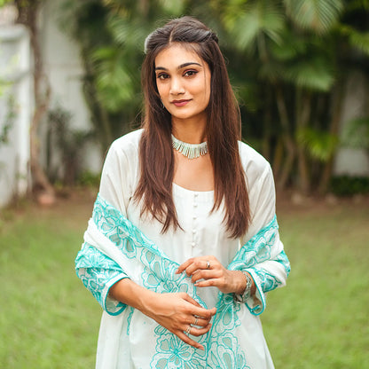 Upper half of the ensemble of the off-white Chanderi suit, including the Chanderi kurta, dupatta, and cotton silk trousers, as worn by the model