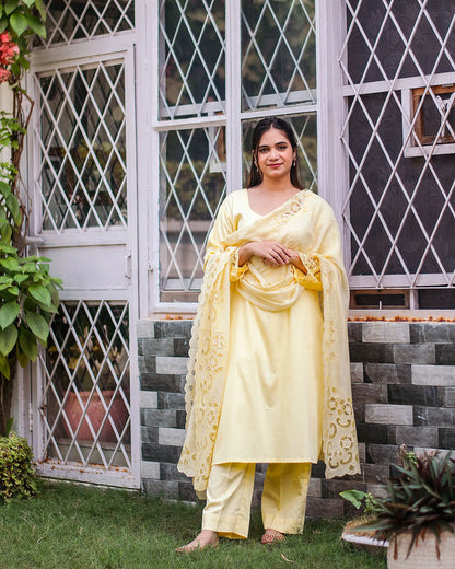 Pastel yellow russian silk kurta & trousers, peach chanderi dupatta with cutwork