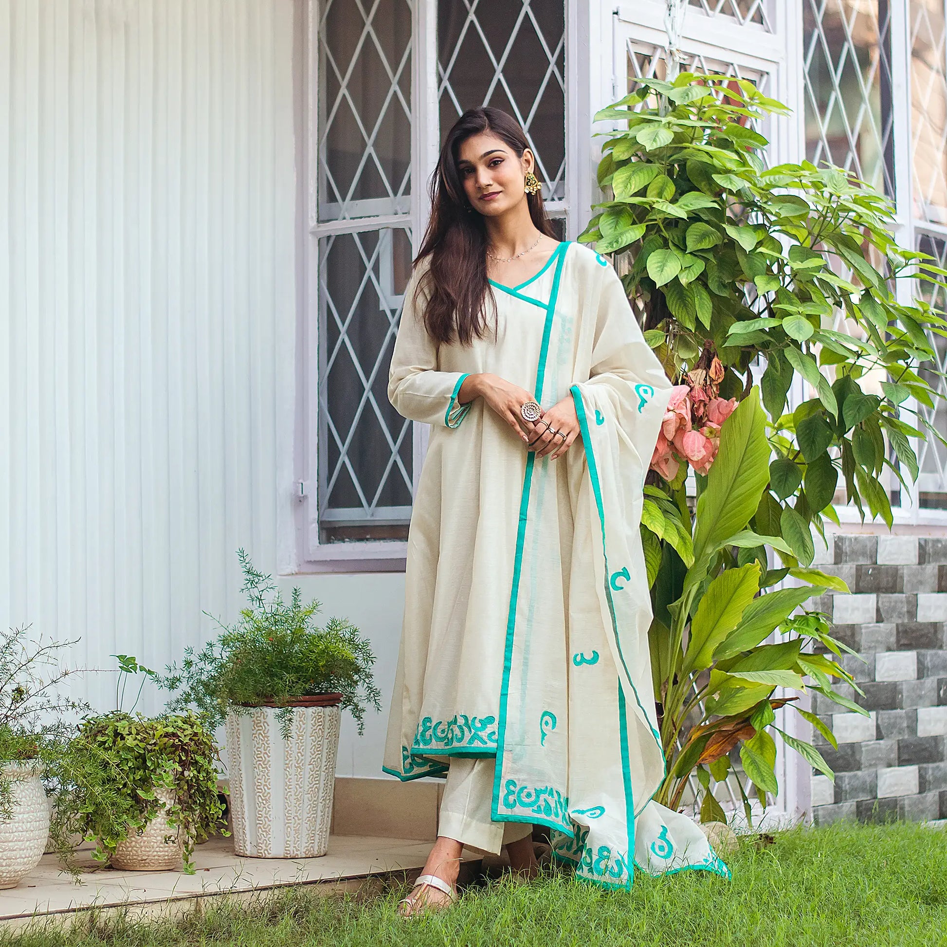 Complete ensemble of the beige chanderi angrakha set, including the angrakha, trousers, and chanderi dupatta, as worn by the model