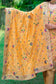 Embroidered Mustard Kurta and Dupatta with Brocade Trousers worn by a stylish woman.