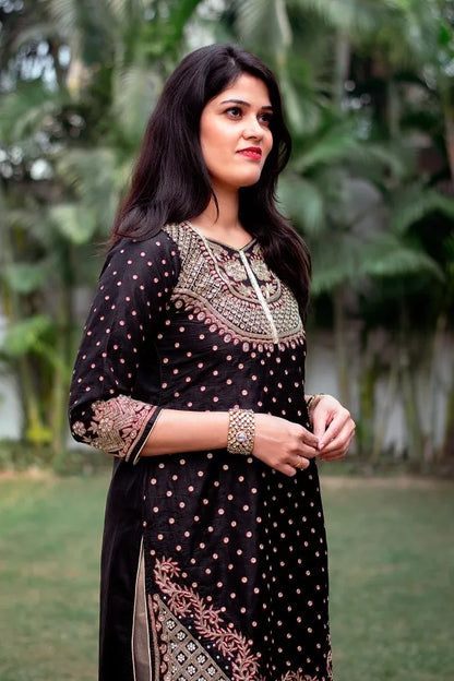 Black silk kurta with zardozi, black chiffon dupatta and golden trouser