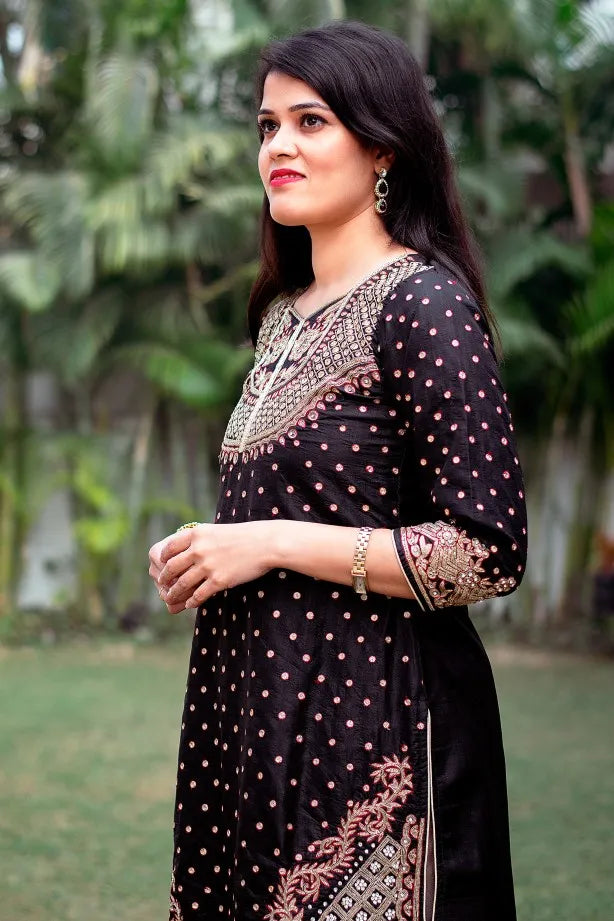 Black silk kurta with zardozi, black chiffon dupatta and golden trouser