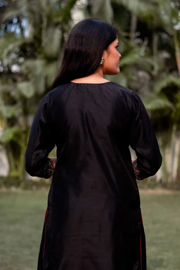 Graceful lady dressed in Black Resham Embroidered Chanderi Kurta With Black Palazzo & Jamawar Silk Dupatta