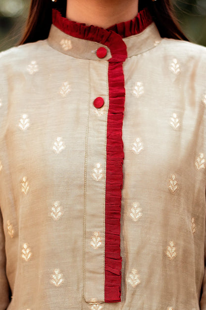 Close-up of the chest area of a linen kurta, showcasing the intricate taupe zari weave pattern