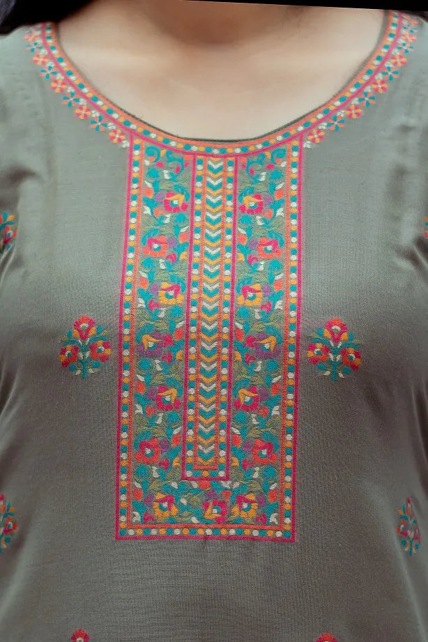  Close-up of the chest area of a Cotton Kani Suit, highlighting the intricate silk-woven patterns and the taupe hue of the kurta