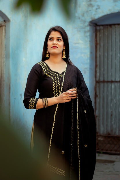 Black chanderi Kurti with applique work black chanderi dupatta and golden trousers