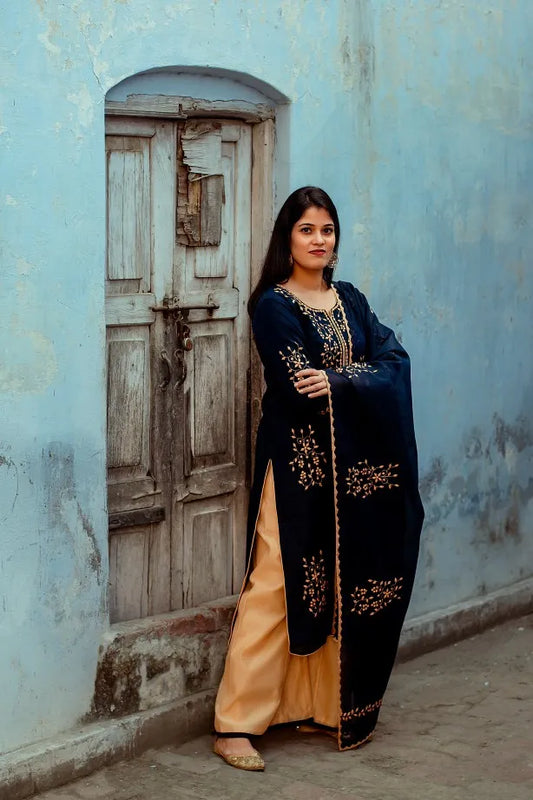 An Indian model in a Dark Blue Chanderi Kurti & Dupatta with applique work and Golden Chanderi Palazzo