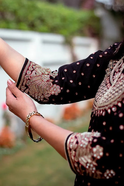 Black silk kurta with zardozi, black chiffon dupatta and golden trouser