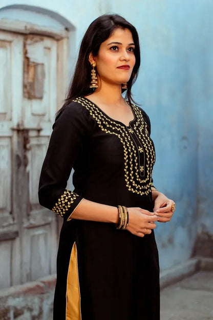 Black chanderi Kurti with applique work black chanderi dupatta and golden trousers