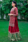 A beautifully adorned Gharara set, featuring intricate hand embroidery on the rich maroon silk fabric.