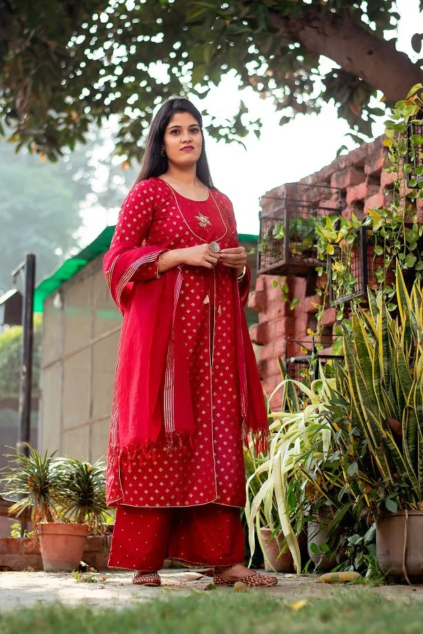 This elegant outfit features intricate Zardozi embroidery in a beautiful shade of red.