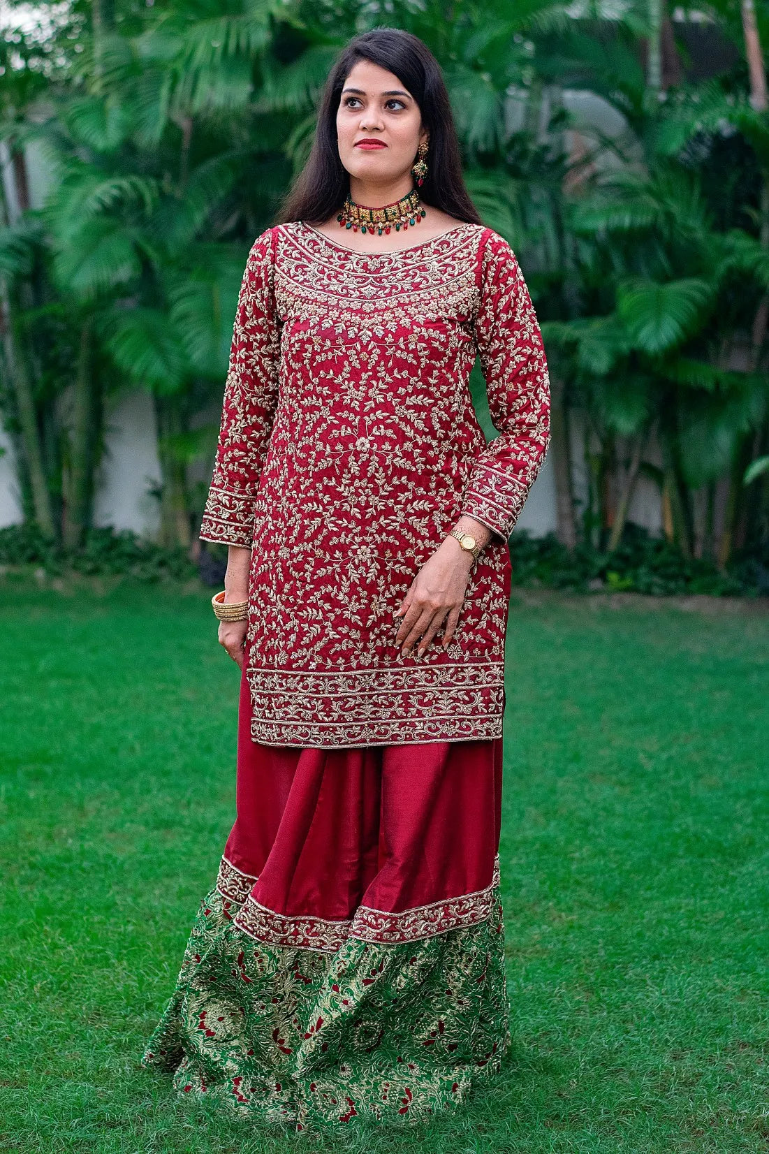 Indian women wearing maroon silk gharara with tissue dupatta