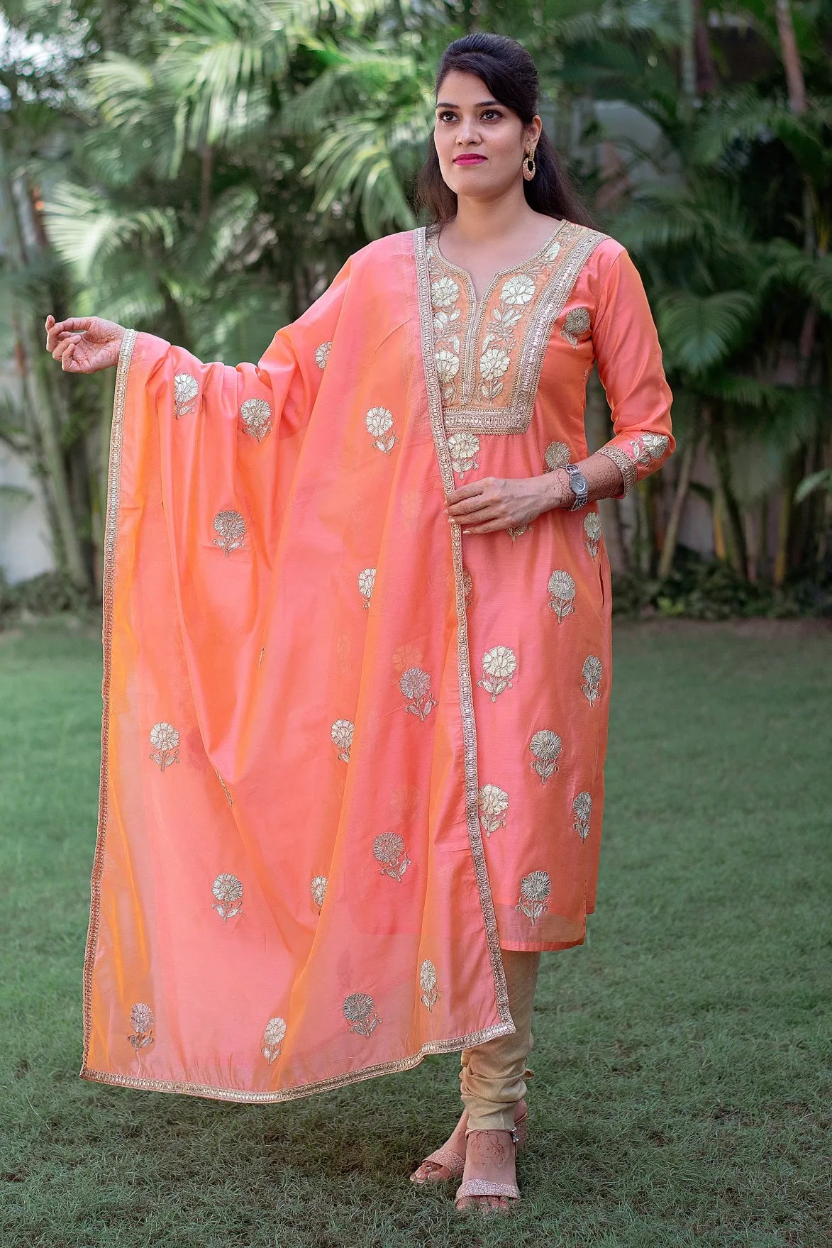 Traditional Indian attire: Peach Chanderi Kurta with Gota Work, Dupatta, and Golden Churidar.
