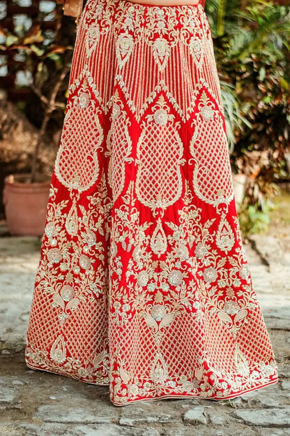 Red velvet zardozi embroidered lehenga and blouse with net dupatta