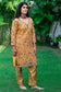 A fashionable woman wearing a Mustard Zardozi & Resham Embroidered Chanderi Kurta And Dupatta With Brocade Trousers.