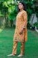 Mustard-colored Chanderi Kurta and Dupatta paired with Brocade Trousers on a woman.