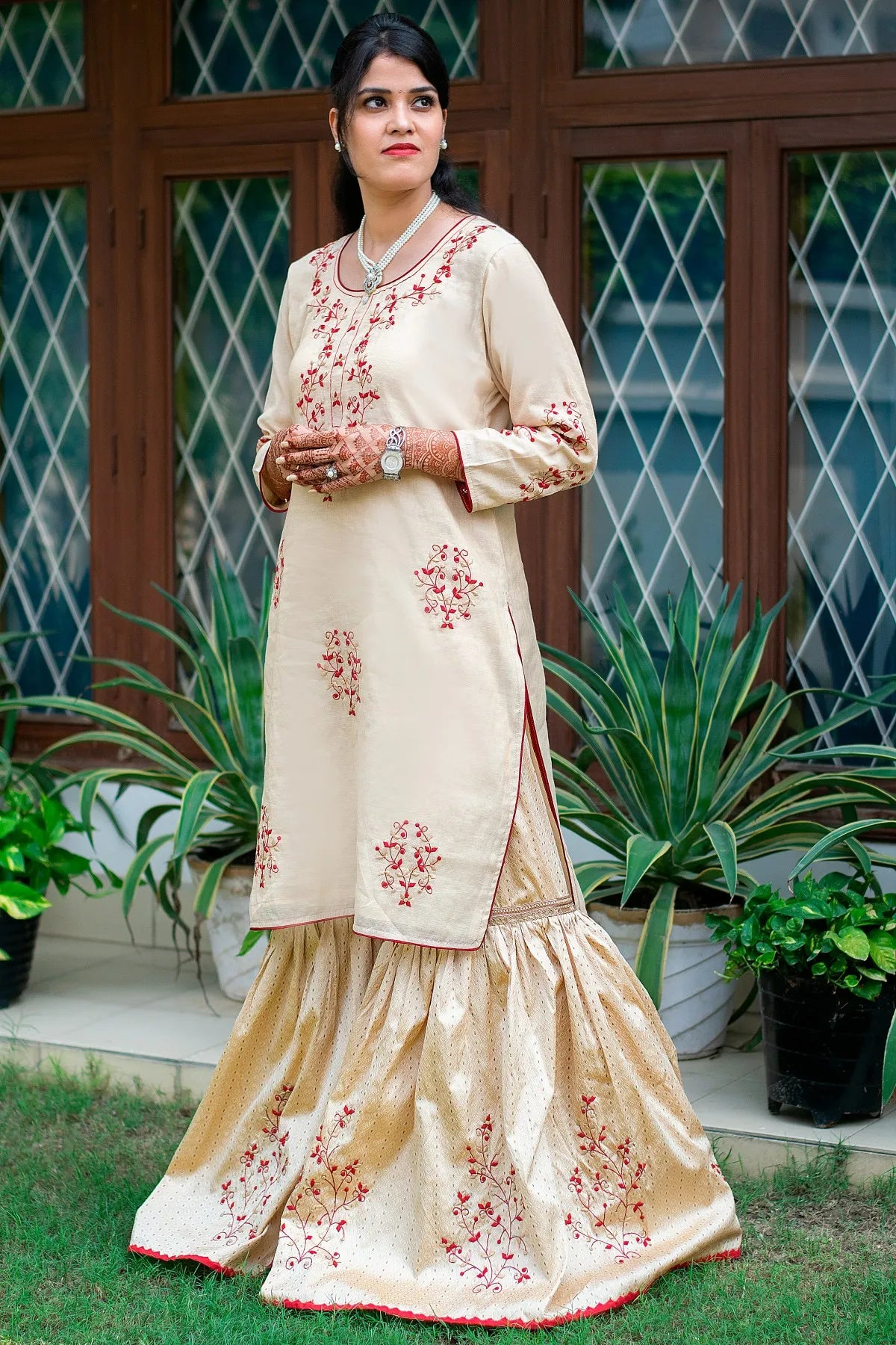 This gold Gharara with applique work is the perfect addition to any festive wardrobe.